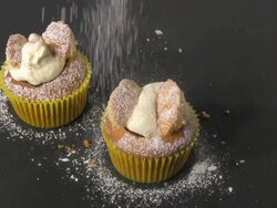 Sprinkling Icing Sugar to Decorate Butterfly Cupcakes Stock Footage