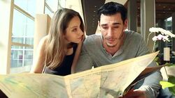 HD:Portrait of tourist couple checking city map at lobby hotel. Stock Footage