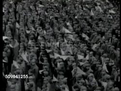1944: NORTHERN CHINA: Chinese mountains. HA PAN Crowd of Communist Chinese people holding flags. Brief glimpse (side) of Communist leader Mao Zedong (1893-1976) on stage. More crowd. Brief Commander of Red Army Zhu De (Chu Teh, 1886-1976) on stage. Instructional Video