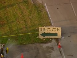 September 12, 2005 aerial zoom out 'decon' sign/ cleaning truck at decontamination site / New Orleans, Louisiana Stock Footage