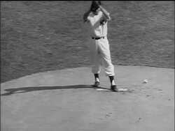 B/W 1955 high angle NY Yankee Tommy Byrne pitching ball in World Series / Yankee Stadium Stock Footage