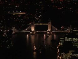 Aerial wide shot Tower Bridge and Thames / zoom out other bridges and cityscape / London, England Stock Footage