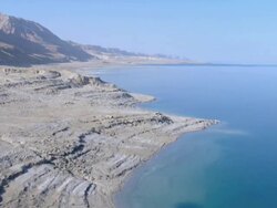 Aerial Dead sea shore near Ein Gedi in the Judea Desert, Israel Stock Footage