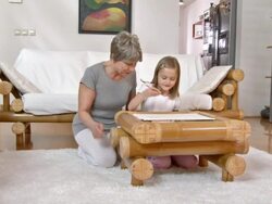 HD DOLLY: Grandmother Helping Her Granddaughter To Draw Stock Footage