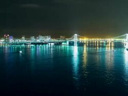 WS T/L View of night scene of rainbow bridge with city skyline / Tokyo, Japan Stock Footage