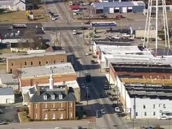 MS AERIAL Shot of house and traffic moving on street / North Carolina, United States Stock Footage