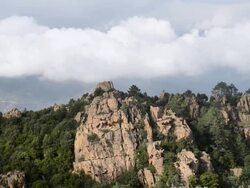 WS View of Fog over mountains of Calanche of Piana, UNESCO World Heritage Site / Porto, Corsica, France Stock Footage