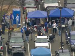 MS AERIAL ZO ZI Shot of Car parking area with people on Wallace Wade Stadium / North Carolina, United States Stock Footage
