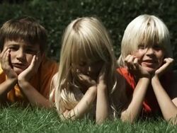 Kids lying on gras (Shot with Red) Stock Footage