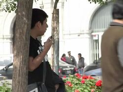 People relaxing in Plaza de San Martin park News Clip