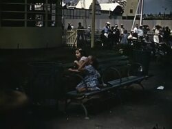 1939 World's Fair - people watching Parachute ride Stock Footage