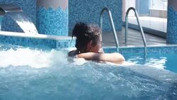 Woman in jacuzzi (HD) Stock Footage