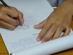 A man writes  with markers Stock Footage