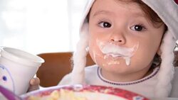Christmas Baby Girl Drinking Yogurt Stock Footage