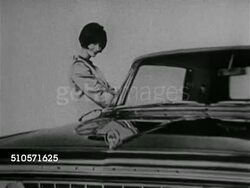 1965: PSYCHOLOGY OF CARS: MS Male driving away in Thunderbird, young male in Jaguar convertible, WS Older sedan & Porsche stopped at red light, Porsche pulling away. [SOT Dr. Kassarjian saying rivalry, competition, racing it out at intersections] Instructional Video