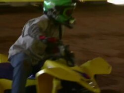 Child drives ATV through the obstacle course. Stock Footage