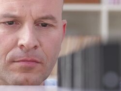 HD: Man Stacking Dominoes Stock Footage