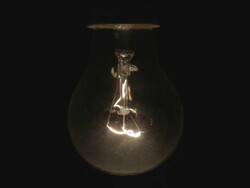 ECU of a lightbulb switching on and off Stock Footage