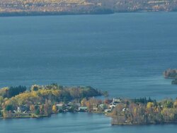 WS ARIEAL View of Rangeley lake with small town /Maine, United States Stock Footage