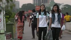 People walking and sat by Yangon River News Clip