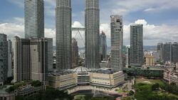 A skybridge provides a way to move between the Petronas Twin Towers in Kuala Lumpur's City Centre. Stock Footage