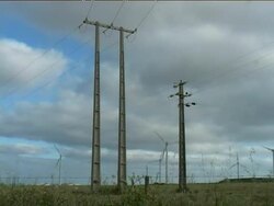 Electric poles in a wind farm Stock Footage