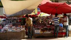 A street vendor selling small electronic products at the Nehru Place market in Delhi Stock Footage
