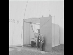 CAN 30 LARGE INFLATABLE TENT ERRECTED ON FIELD IN CZECH REPUBLIC, TRUCK DRIVEN INSIDE THE TENT News Clip