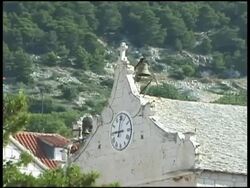 Mediterranean Village Church Clock Bell Rings at 9am Stock Footage