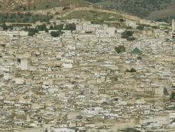 WS PAN View of city of Fez with traditional houses and hills and blue sky / Fez, Fes-Boulemane, Morocco Stock Footage