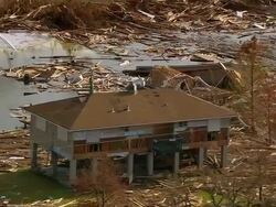 September 13, 2005 aerial zoom out destroyed houses and debris along Grand Lagoon / Slidell, Louisiana Stock Footage