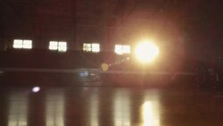 A basketball player dribbles down court with opponents in pursuit. Stock Footage