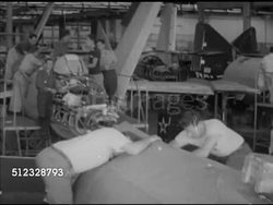 1952: AIRCRAFT ENGINEERING:  EXT VS Tractor pulling Grumman F9F Panther fighter jet w/ wings folded up, INT engineers building partially built F9F fighter aircrafts in hangar, EXT parked jet outside lowering wings. War effort, production, U.S. Navy Instructional Video