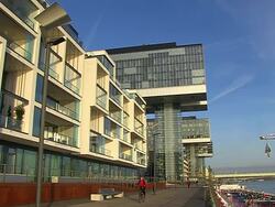 MS LA Shot of Modern buildings at Rheinau Halbinsel with Rhine river / Cologne, North Rhine Westphalia, Germany Stock Footage