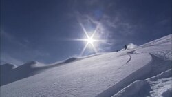 The sun shines on a downhill skier. Stock Footage