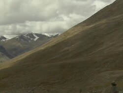 Pan Left Reveal Mountain with Dense Clouds Lhasa Tibet China  Stock Footage