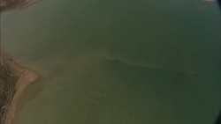 The Colorado River flows through barren terrain. Stock Footage