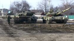 Pro Russian forces on tanks firing into the air News Clip