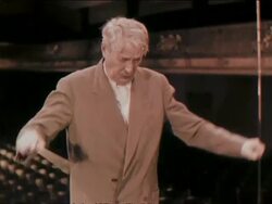 1956 Medium shot Boston Symphony Orchestra conductor Charles Munch conducting with baton/ AUDIO Stock Footage