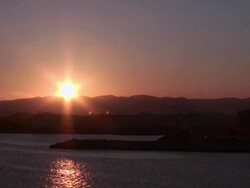 Ship leaving Barcelona harbor at sunset, Spain Stock Footage