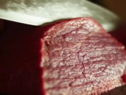 Cutting sirloin beef Stock Footage