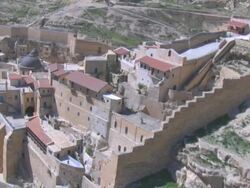 Aerial Mar Saba Monastery built in to cliff in the Judea desert, Judea, Israel Stock Footage
