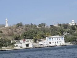 Christ statue on hill above and the river of Havana Cuba Stock Footage