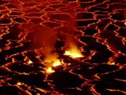 MS Molten rock cools and forms plates on surface of lava lake / Goma, Virunga National Park, Democratic Republic of the Congo Stock Footage