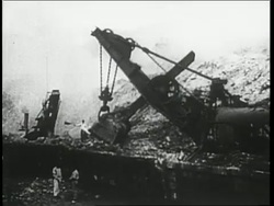 Numerous construction workers help build the Panama Canal. News Clip