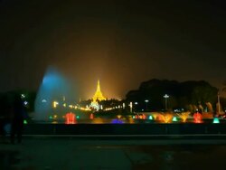 fountain with colorful illuminations at night near the Shwedagon Pagoda Stock Footage