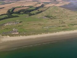 Aerial view over the beach towards the Old Course at St. Andrews Links / Fife, Scotland Stock Footage
