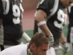 CU, PAN, American football coach talking to players on sidelines, Staten Island, New York, USA Stock Footage