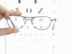 HD: Glasses On An Eye Chart Background Stock Footage