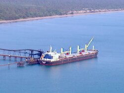 WS AERIAL View of cargo ship and coal mine area / Darwin, Northern Territory, Australia Stock Footage